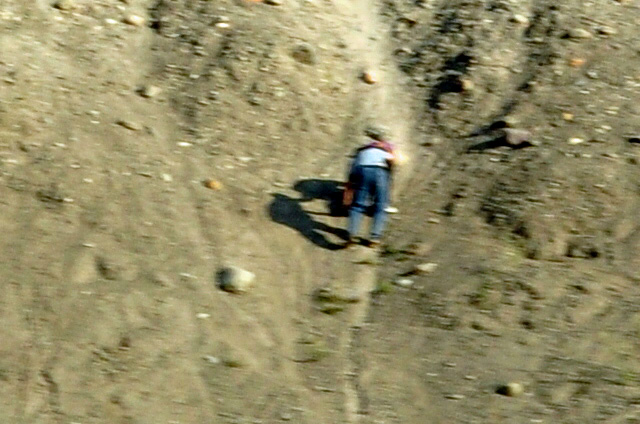 climbing a steep sand bank