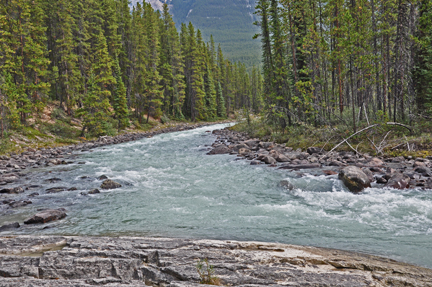 the left side of the water before it hits the falls