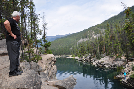 Lee looking down the cliff at Horseshoe Lake