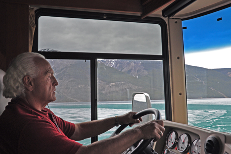 Lee driving past Muncho Lake