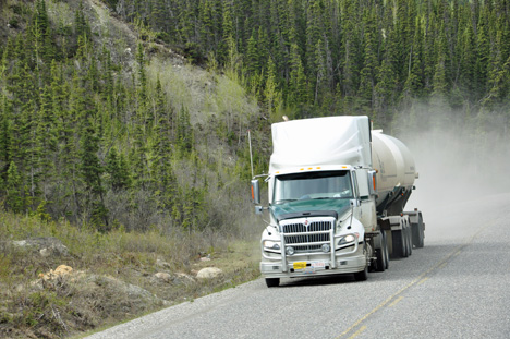 truck throwing road dust at the two RV Gypsies