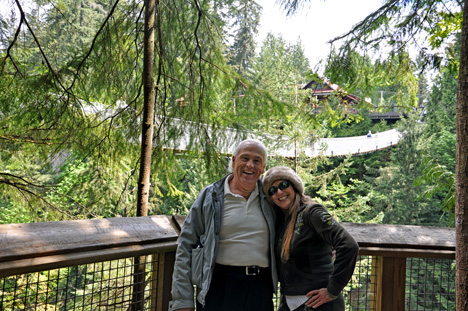 Lee and Karen Duquette and a view of the Capilano Bridge from Cliff Hanger area 