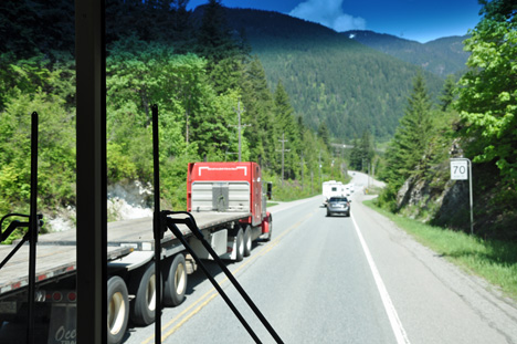 semi pulling too flat beds passing in a no passing zone