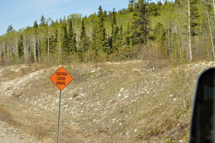 sign - caution loose gravel