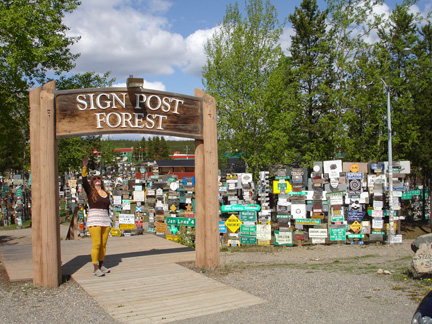 Karen Duquette at the entry to Sign Post Forest