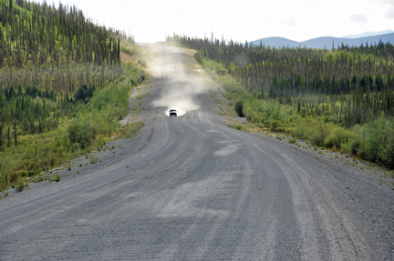 bad road - car coming throwing dust