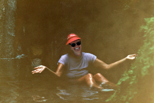 Karen Duquette sitting in the icy cold water