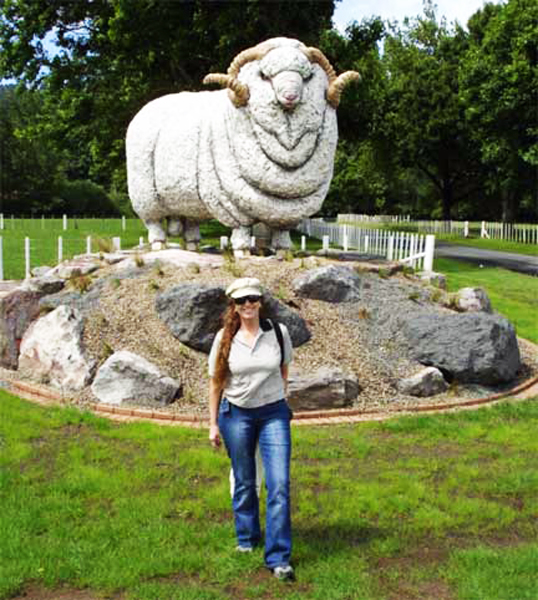 Karen Duquette near a giant sheep statue