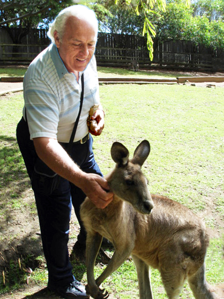 Lee Duquette petting a kangaroo