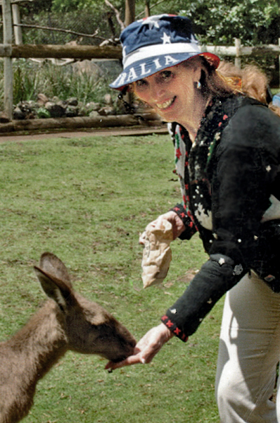 Karen  feeding a kangaroo