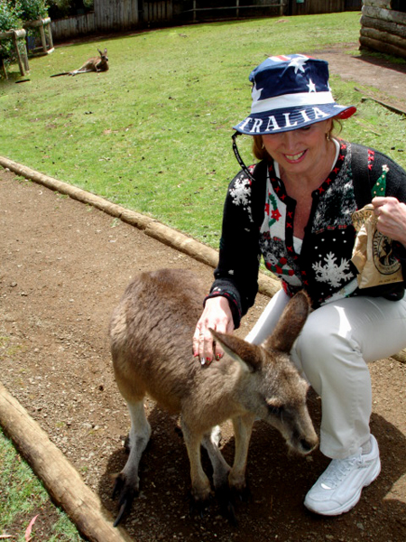 Karen Duquette petting a kangaroo