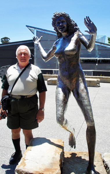 Lee Duquette and a statue