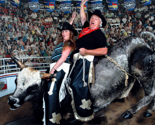 Karen and Lee posed for photos on a bronco bull. 