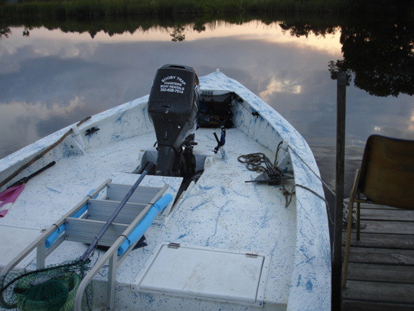 a weird boat with the engine in the bow 