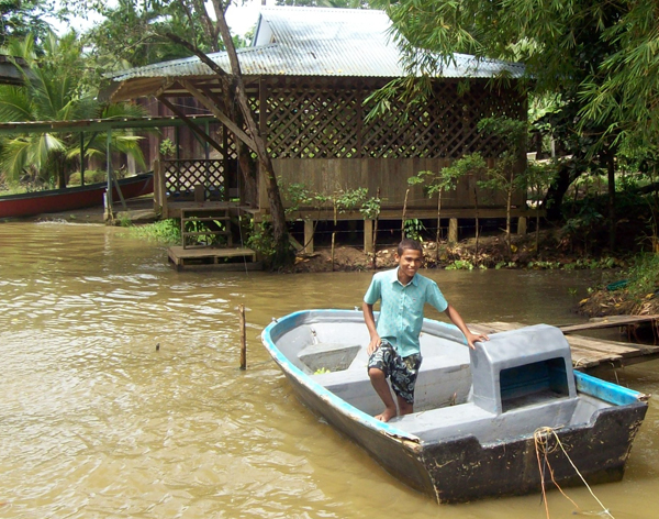 boy on a small boat