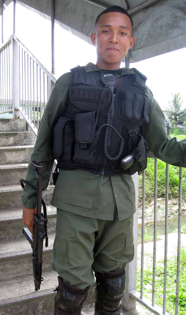 policeman, heavily armed