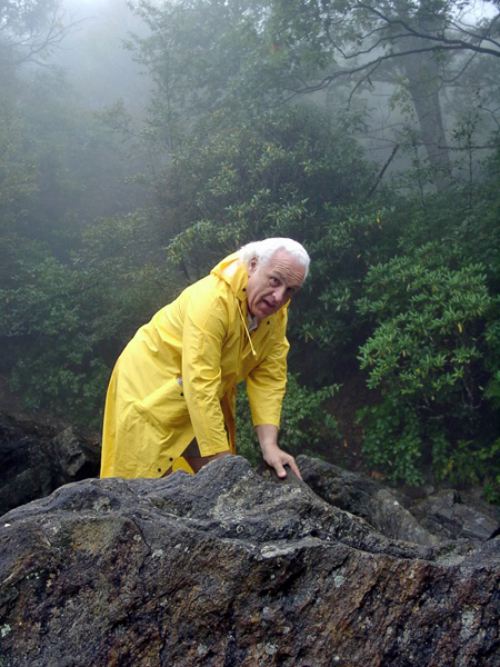 Lee Duquette climbing over the rocks