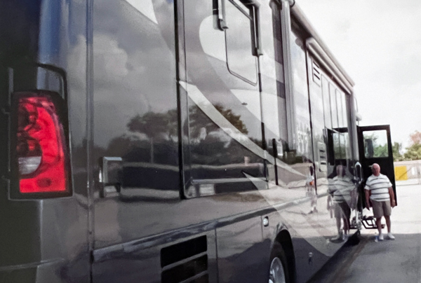 Lee Duquette by the door of the RV