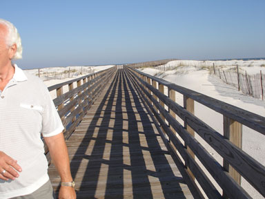 Lee on the boardwalk to the beach