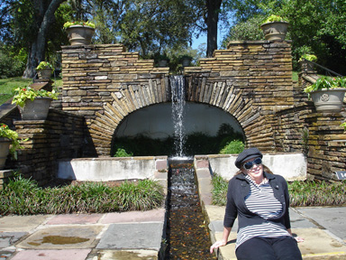 Karen sitting by a fountain
