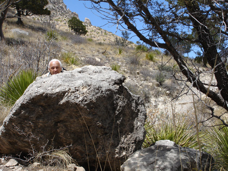 Lee Duquette hiding behind a big rock