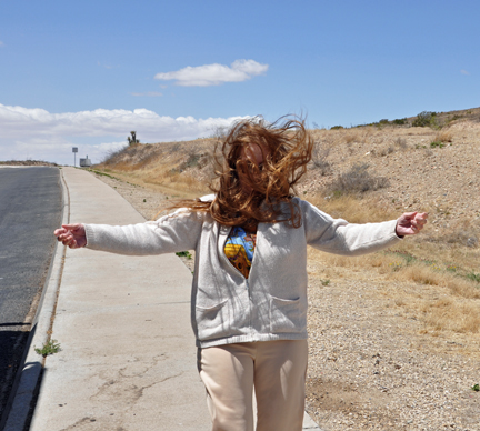 Karen trying to walk in the strong winds