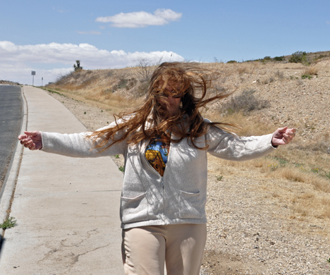 Karen trying to walk in the strong winds