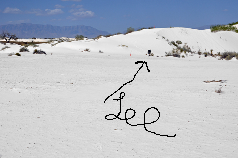 Lee wanders up the white sand hill