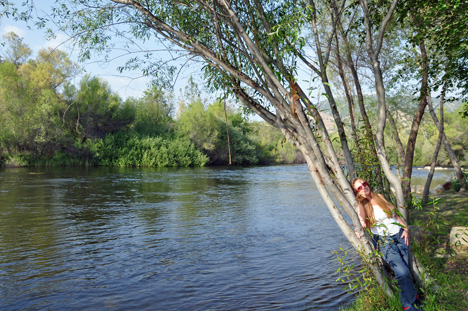 Karen on the beach enjoying a view of the river & the mountain 