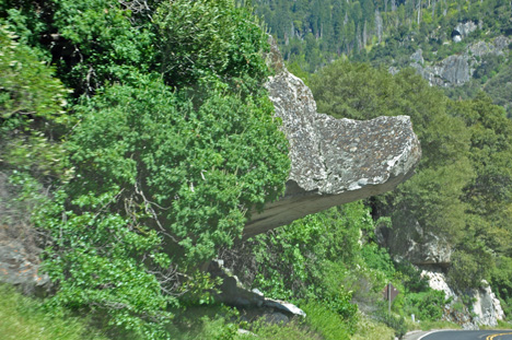 a rock formation over the road