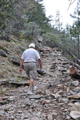 Lee on rocky trail at the beginning of hike