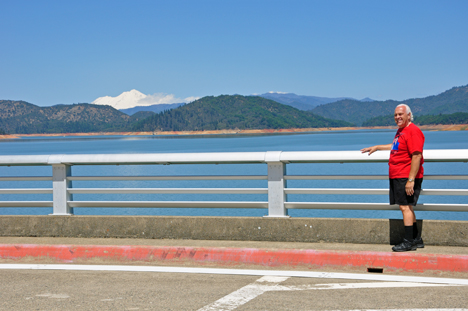 Lee Duquette looking at Shasta Lake and Mt. Shasta from the bridge
