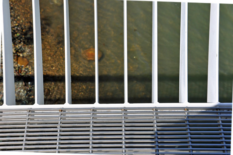 Looking down into the river through the side of the Sundial Bridge