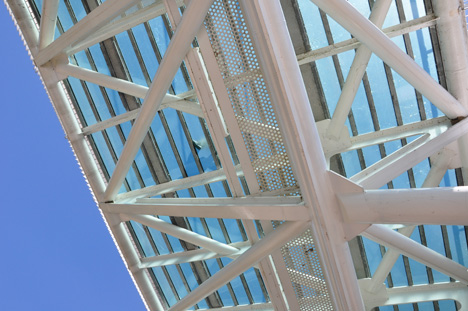 looking up, there are people walking on the bridge