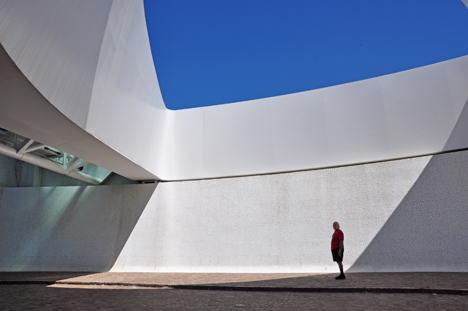 Lee walks under the bridge to look up at the pylon