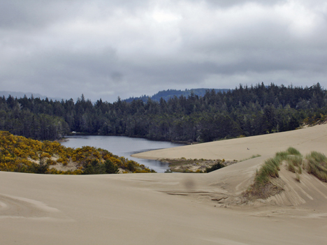 sand dunes and a lake