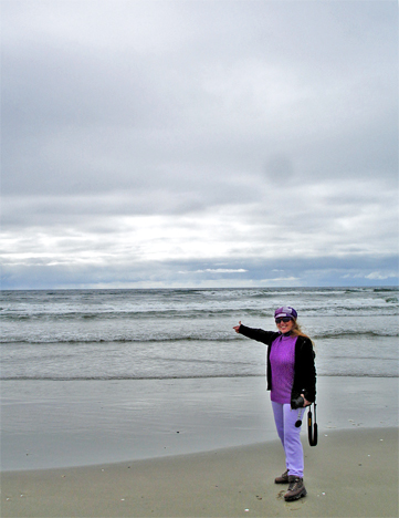 Karen Duquette pointing to the Pacific Ocean