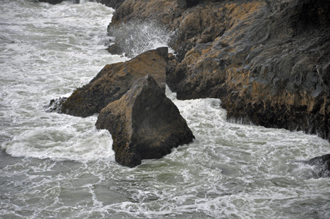 waves against the cliffs