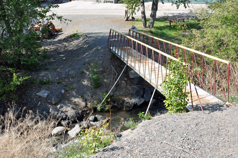 A small bridge and brook inside Brookside Campsite