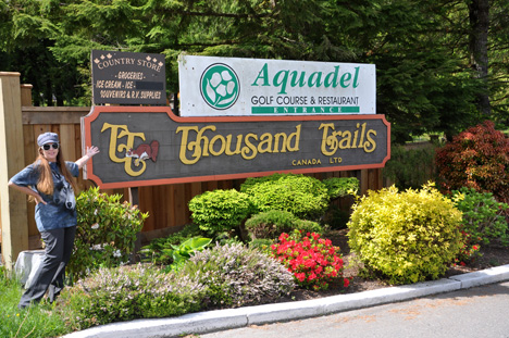 Karen Duquette at the Thousand Trails entrance sign