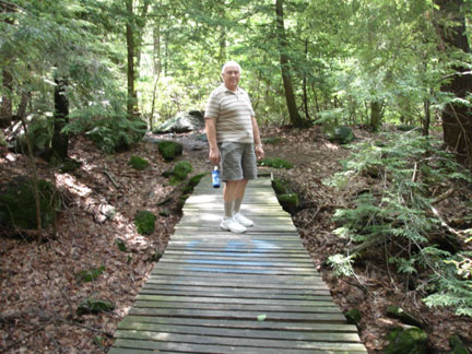 lee on the bridge to Buttermilk Falls