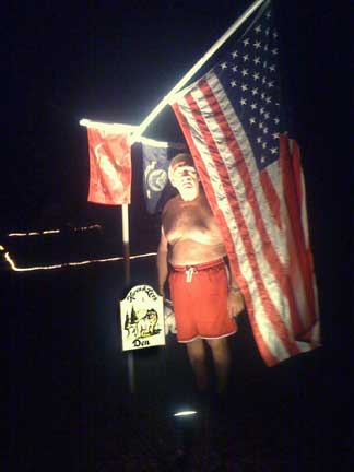 Lee and the US flag at campsite