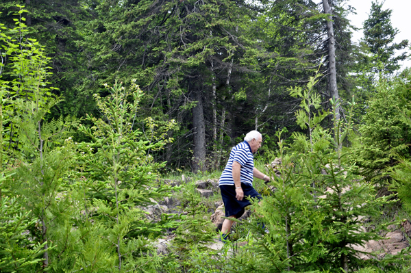 Lee Duquette makes his way up a small hill