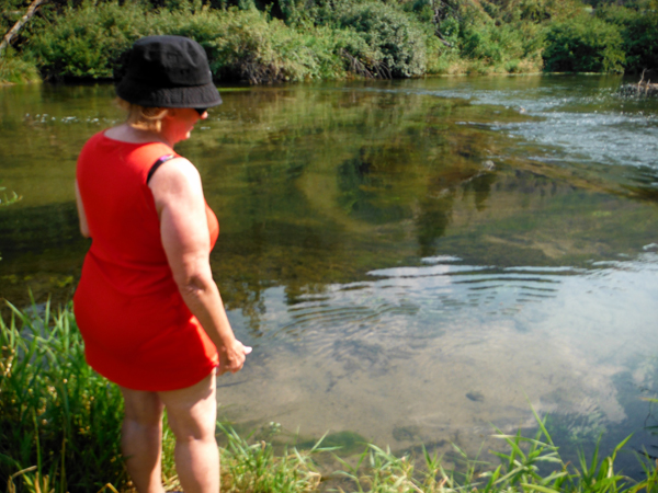 Karen Duquette trying to decide if she really wanted to go iin the cold Portneuf River