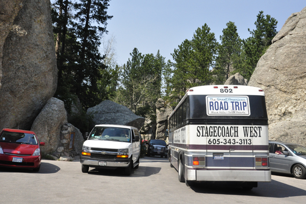 tour bus trying to get through the road