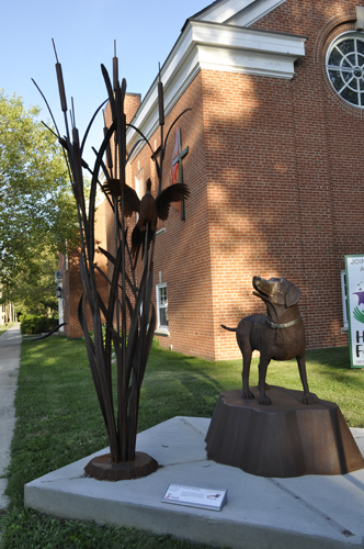 dog and bird sculpture