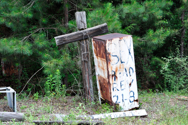 cross and anti-sex sign