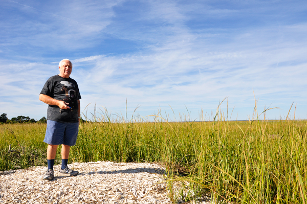 Lee Duquette on a mound of shells
