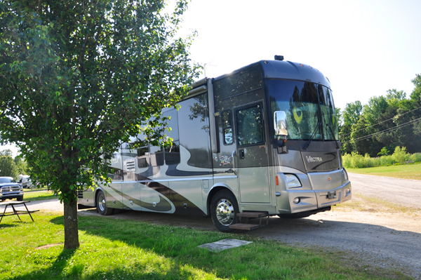 The RV of the two RV Gypsies in their new yard