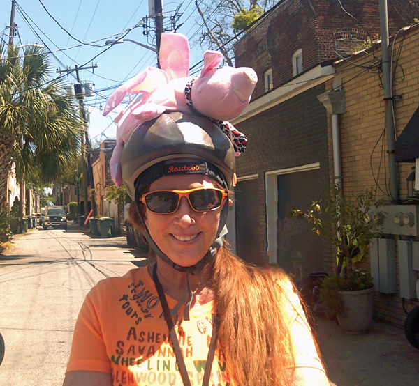 Karen Duquette in a pink pig helmet